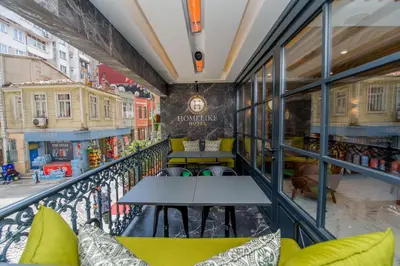 a balcony with tables and chairs in a store at Homelike Hotel in Istanbul