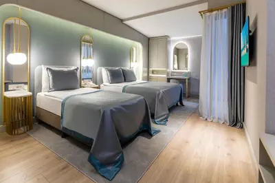 a rendering of a hotel room with two beds at Hotel Genova Istanbul Old City in Istanbul