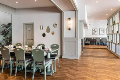 a dining room with a table and chairs at Hotel Genova Istanbul Old City in Istanbul