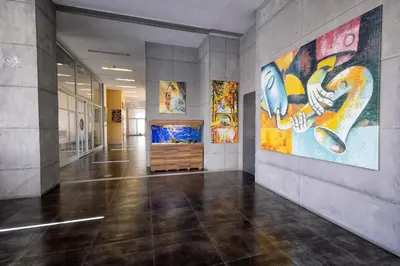 a hallway with paintings on the walls of a building at My House N5 Suites Hotel in Esenyurt