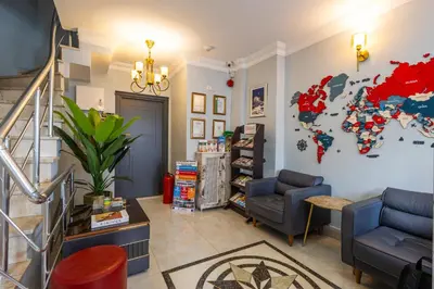 a living room with a map of the world on the wall at Sultanahmet inn Hotel in Istanbul