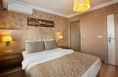 a bedroom with a large bed in a room at Sultanahmet inn Hotel in Istanbul