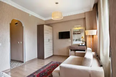 a living room with a couch and a table at Sultanahmet inn Hotel in Istanbul