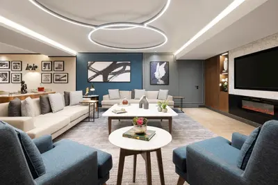 a living room with couches and a flat screen tv at Tzl Suites Hotel Nişantaşı in Istanbul