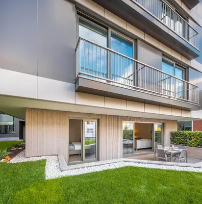 an apartment building with a balcony and a yard at Tzl Suites Hotel Nişantaşı in Istanbul