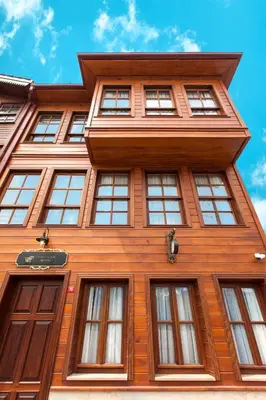 a tall wooden building with windows at Ferman Konak Hotel-Special Category in Istanbul