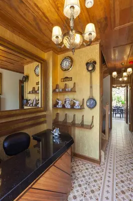 a room with a counter with clocks on the wall at Ferman Konak Hotel-Special Category in Istanbul