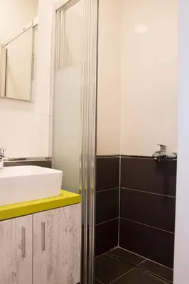 a bathroom with a sink and a shower at Zin D Home Dudullu Otel in Istanbul