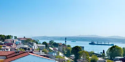 a view of a city with a river and a boat at Ferman Hotel Old City -Special Category in Istanbul