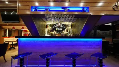 a bar with blue lighting in a restaurant at Endglory Hotel in Corlu