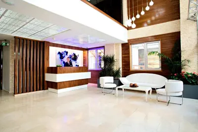 a lobby with a white table and chairs at Endglory Hotel in Corlu