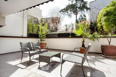 a patio with chairs and a table and some plants at NOA - Sungu 1 in Istanbul