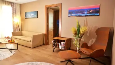 a living room with two chairs and a couch at Bricks Hotel İstanbul in Istanbul