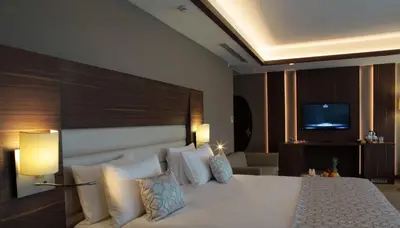 a hotel room with a bed and a television at Bricks Hotel İstanbul in Istanbul