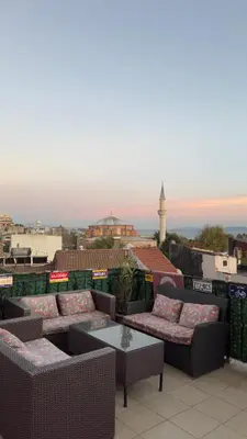 a patio with couches and a table on a roof at Green Life Apart Hotel in Istanbul