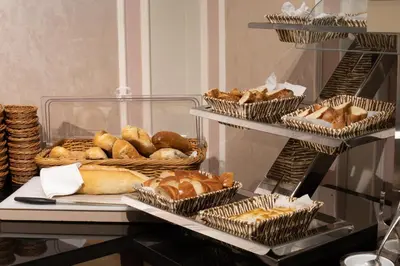 a bunch of loaves of bread and baskets of pastries at The Time Hotel Marina in Istanbul