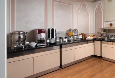 a kitchen with a counter with a coffee maker at The Time Hotel Marina in Istanbul