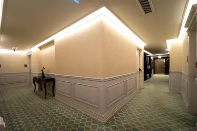 a hallway with a wall with a table in it at The Time Hotel Marina in Istanbul