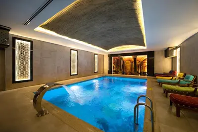 a large swimming pool in a hotel room at The Time Hotel Marina in Istanbul