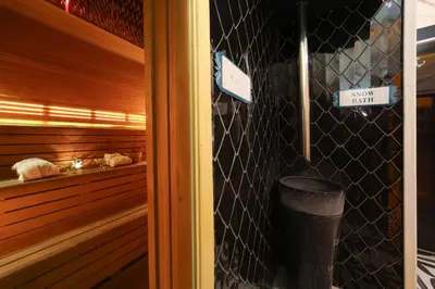 a room with a sauna with a trash can and signs at The Time Hotel Marina in Istanbul