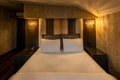 a bedroom with a large white bed with two pillows at Golden Dream Otel in Istanbul
