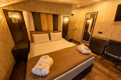 a hotel room with a bed with towels on it at Golden Dream Otel in Istanbul