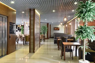 a restaurant with tables and chairs and a dining room at The Elegant Hotel in Istanbul