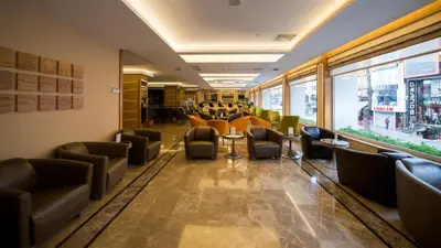 a waiting room with couches and chairs in a building at Prestige Hotel Old City in Istanbul