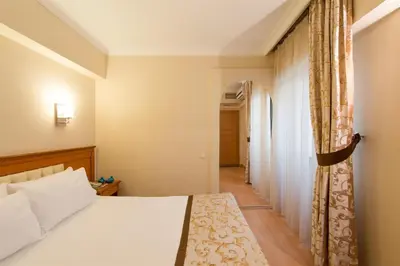 a hotel room with a bed and a corridor at Prestige Hotel Old City in Istanbul