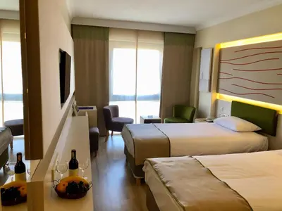 a hotel room with two beds and a television at Prestige Hotel Old City in Istanbul