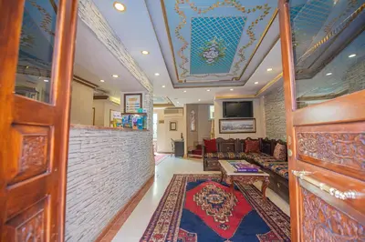 a living room with a couch and a table at Kaftan Hotel in Istanbul