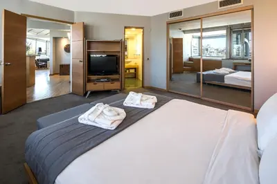 a bedroom with a large bed with towels on it at Taxim Suites Residences Istanbul in Istanbul