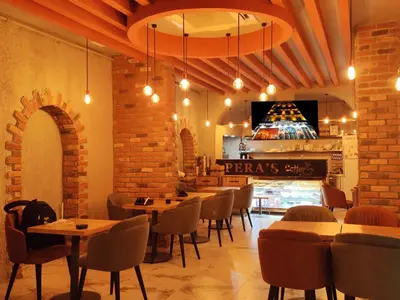 a restaurant with tables and chairs and a pizza shop at The Golden Pera's Hotel & Spa in Istanbul