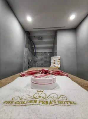a bedroom with a bed with a white blanket on it at The Golden Pera's Hotel & Spa in Istanbul