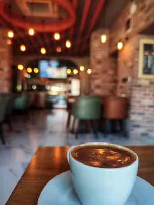 a cup of coffee sitting on a table at The Golden Pera's Hotel & Spa in Istanbul