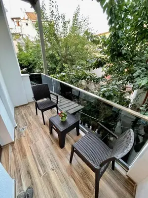 a balcony with two chairs and a table at Oldtown Sultanahmet Suites in Istanbul