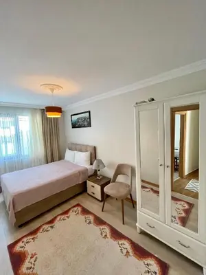 a bedroom with a bed and a chair and a mirror at Oldtown Sultanahmet Suites in Istanbul
