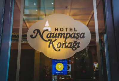 a sign in the window of a hotel korea korea at Hotel Naumpasa Konagi in Istanbul