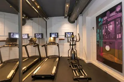 a gym with three treadles in a room at Tulip City Hotel & Spa in Istanbul