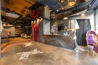 a room with a bar with a table and chairs at Tulip City Hotel & Spa in Istanbul