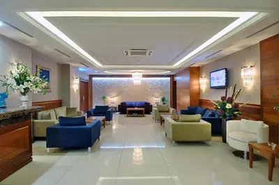a lobby with couches and chairs in a hotel at Tugcu Hotel Select in Bursa