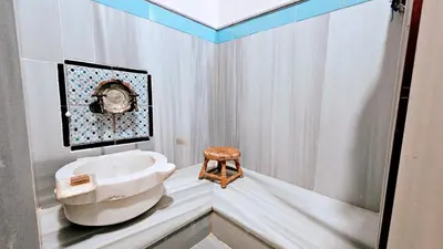 a bathroom with a sink and a toilet at Otantik Hotel & Spa in Bursa