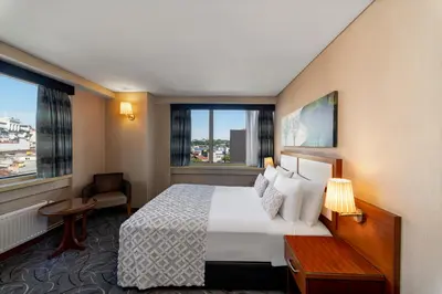 a hotel room with a large bed and a window at Istanbul Golden City Hotel in Istanbul