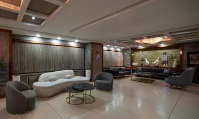 a lobby with a couch and chairs and a table at Istanbul Golden City Hotel in Istanbul