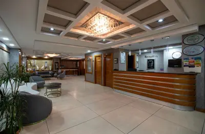 a lobby with a bar in a hospital at Istanbul Golden City Hotel in Istanbul