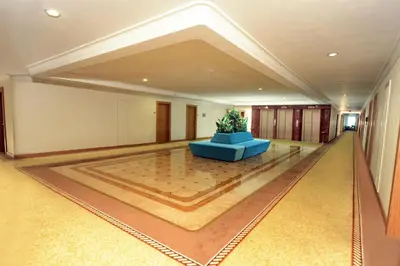 a large lobby with a blue couch in the middle at Akgun Istanbul Hotel, WorldHotels Elite in Istanbul