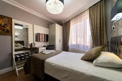 a hotel room with a bed and a window at Levent Hotel Istanbul in Istanbul