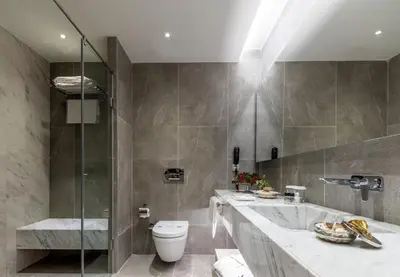 a bathroom with a tub and a toilet and a shower at Hotel Amira Istanbul in Istanbul