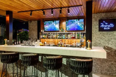 a bar with bar stools in a restaurant at Hotel Amira Istanbul in Istanbul