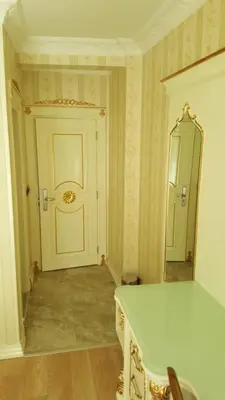 a room with a door and a table and a mirror at Best Town Hotel in Istanbul